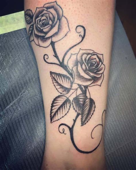 roses on a vine tattoo|gothic style rose vine tattoo.